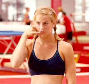 Still photo from movie "Stick It" of gymnast Mina Hoyt (Maddy Curley) talking on an imaginary phone