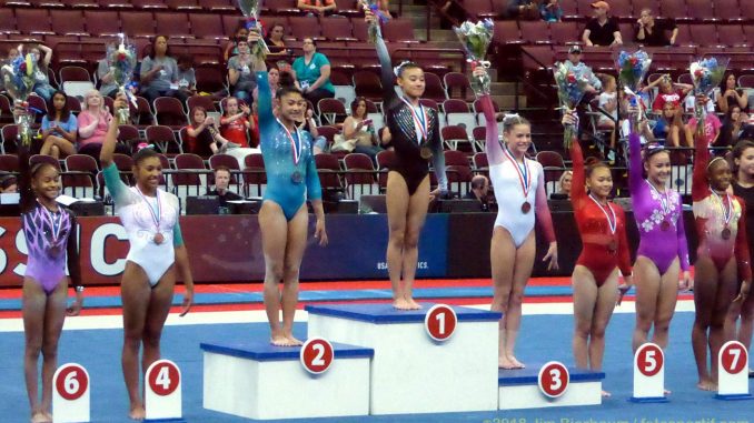 gymnasts on awards stand